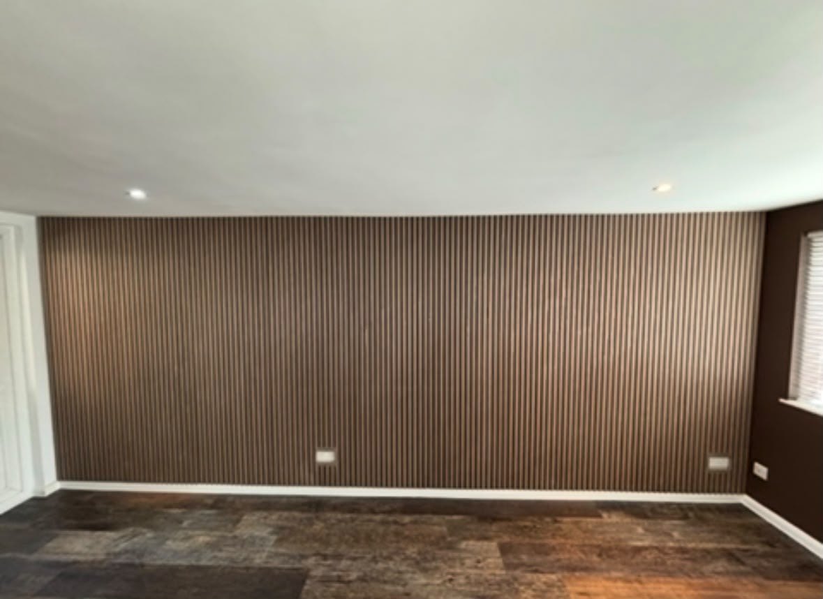 Slatted wood panelling feature wall with new dark wood-effect flooring, Ruislip